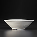 A small glazed white porcelain shallow bowl on 'bi-disc' foot, Late Tang dynasty-Five Dynasties period, 9th-10th century