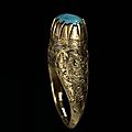 A seljuk nielloed gold ring with turquoise seal. persia, 12th-13th century