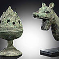 A small bronze 'hill' censer and cover, han dynasty (206 bc-ad 220) & an unusual bronze animal head fitting, zhou dynasty