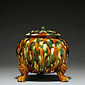 A sancai-glazed pottery tripod jar and a cover, Tang dynasty (618-907)