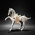 A large painted pottery model of a prancing horse, Tang Dynasty