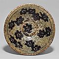 A jizhou paper-cut resist-decorated tea bowl. southern song-yuan dynasty, 13th-14th century