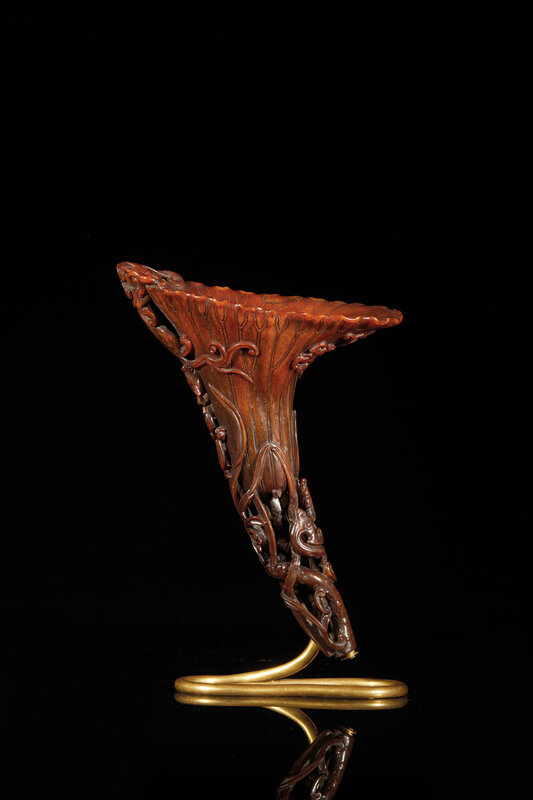 A carved rhinoceros horn libation cup, China, Qing