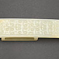 A white jade scabbard slide, probably warring states period (475-221 bc)