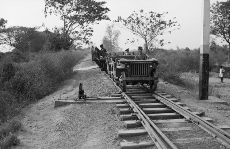 Jeeps_adapted_for_running_on_railway_tracks_head_southwards_from_Mandalay,_Burma,_21_March_1945__SE3615