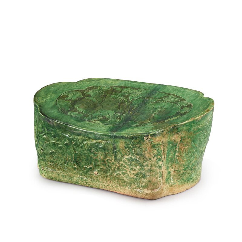 A carved Cizhou green-glazed 'floral' pillow, Song dynasty (960-1279)