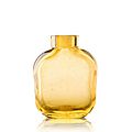 An amber glass bottle of flattened square shape. Photo Lyon & Turnbull