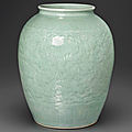 A large celadon-glazed carved ovoid jar, 18th century