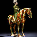 A rare and unusual sancai-glazed pottery equestrian, tang dynasty (ad 618-907)