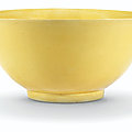 A large yellow-glazed bowl, kangxi six-character mark in underglaze blue within a double circle and of the period (1662-1722)