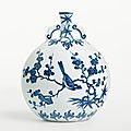 A magnificent blue and white moon flask with birds on flowering branches. qing dynasty, yongzheng period