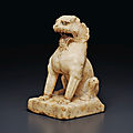 A small white marble figure of a seated lion, tang dynasty (ad 618-907)