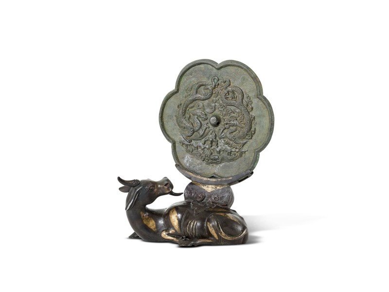 A bronze 'twin dragon' mirror, Song dynasty, and a parcel-gilt bronze mirror stand, Ming dynasty