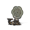 A bronze 'twin dragon' mirror, song dynasty, and a parcel-gilt bronze mirror stand, ming dynasty