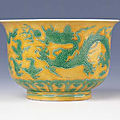 A rare yellow-ground 'green dragon' deep bowl, encircled zhengde four-character mark and of the period (1506-1521)