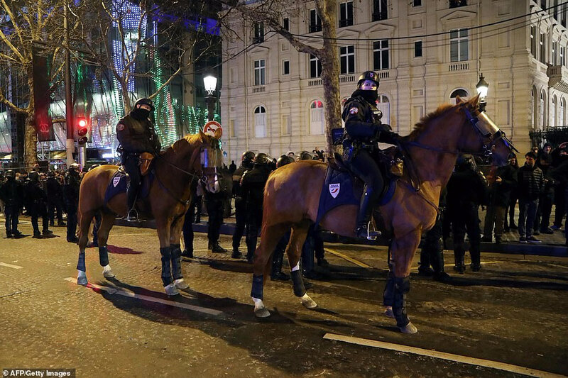 7934488-6537891-Mounted_police_patrol_on_the_Champs_Elysees_Avenue_in_Paris-a-10_1546107063191