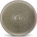 A rare inscribed 'Yaozhou' 'floral' bowl, Northern Song dynasty (960-1127)