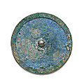A brightly patinated bronze mirror, Han dynasty
