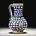 An iznik polychrome pottery jug, turkey, circa 1600