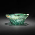 A moulded glass bowl . persia, 10th/ 11th century